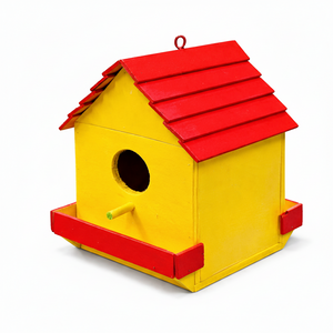 Yellow birdhouse with a red roof on a white background