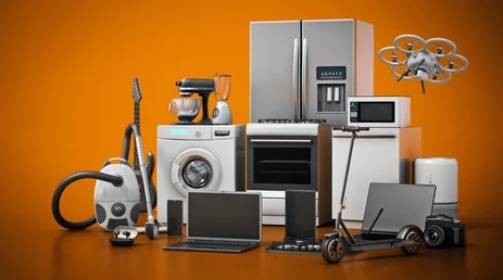 Collection of home appliances and electronic devices on a wooden surface with an orange background